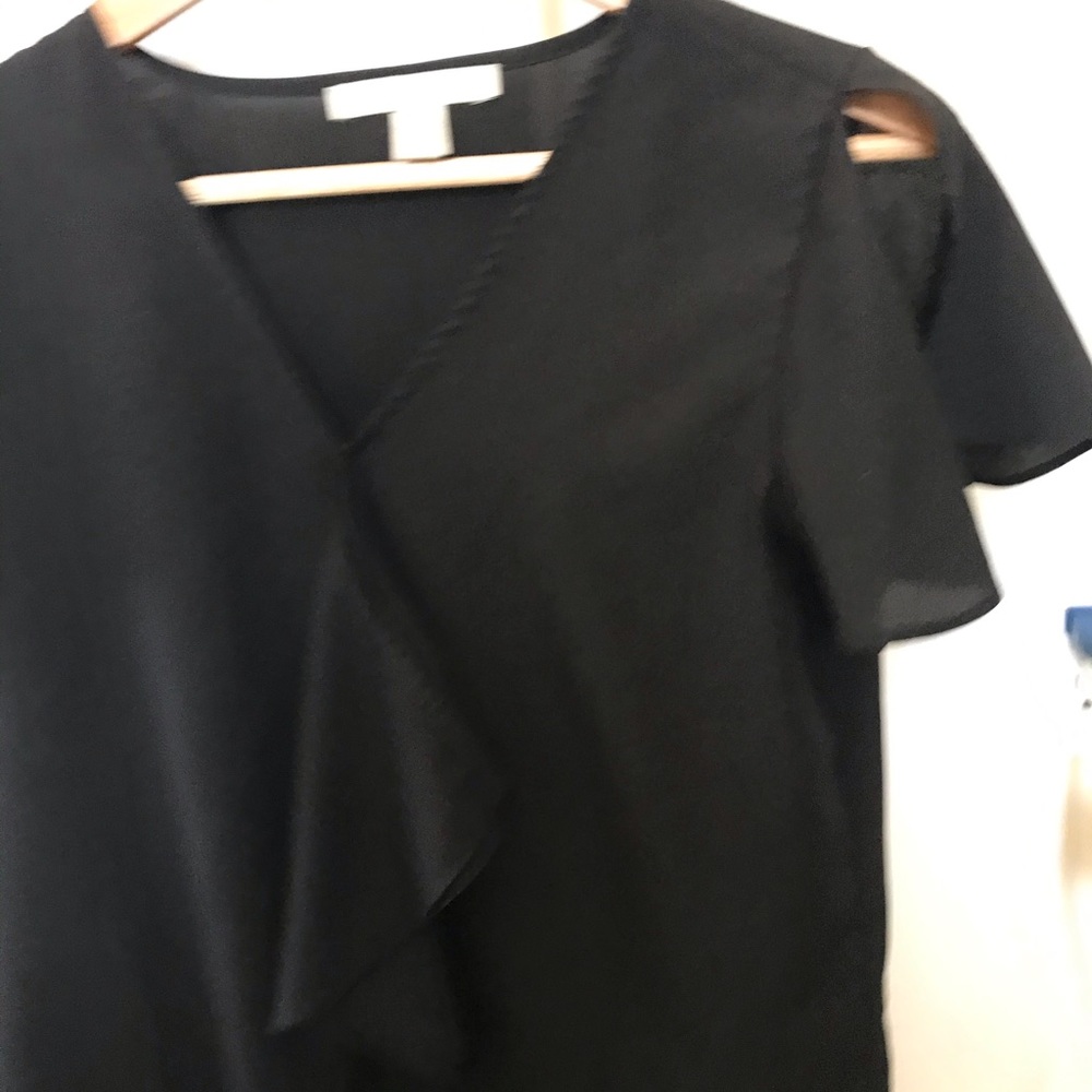 Black top with ruffle sleeves